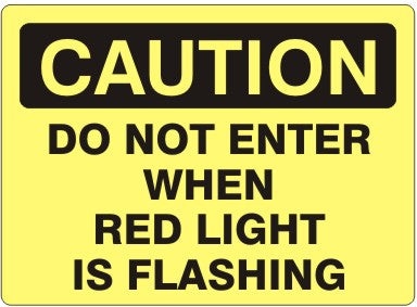 DO NOT ENTER WHEN RED LIGHT IS FLASHING - CAUTION SIGN