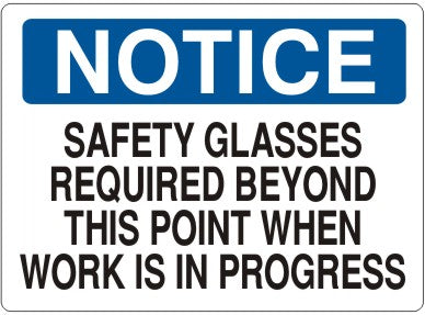 SAFETY GLASSES REQUIRED BEYOND THIS POINT WHEN WORK IS IN - NOTICE SIGN